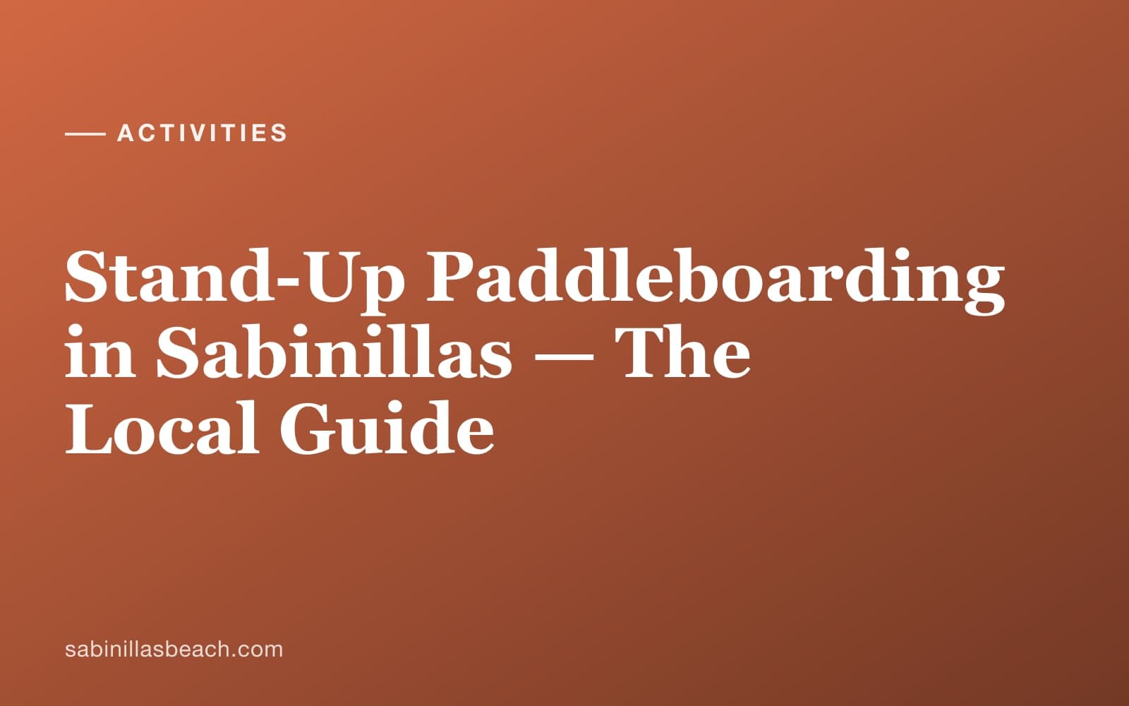 Stand-up paddleboarder on calm Mediterranean waters off Sabinillas beach, western Costa del Sol coastline behind